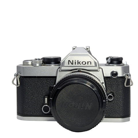Nikon FM 35mm SLR Film Camera (Chrome, Excellent Plus) with Nikkor 50mm f/1.8 Lens – Camera Trading Company