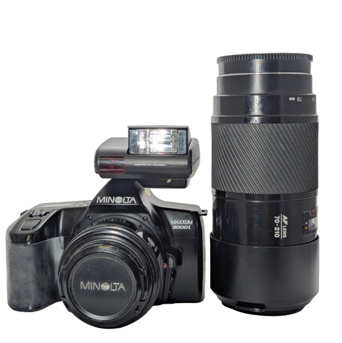 Minolta  Maxxum  3000i camera with two lenses. A nice beginners kit.