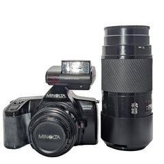 Minolta  Maxxum  3000i camera with two lenses