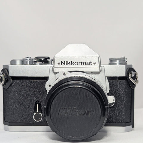 Nikkormat FT2 35 mm SLR Film Camera (Chrome) w/ Nikkor 50 mm f/2 Lens – Near Mint with Half Case | Camera Trading Company